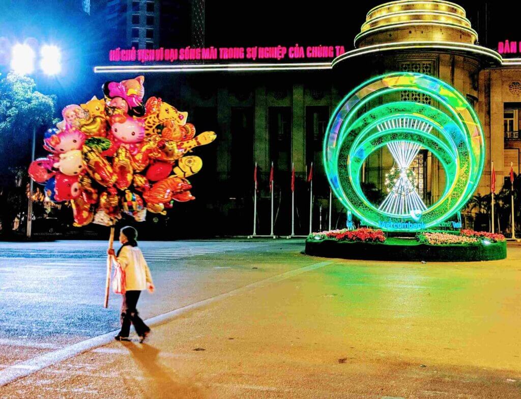 Lady with balloons Vietnam Tet