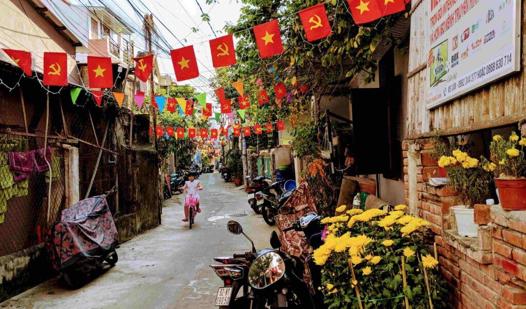 Hoi An Alleys and communist flags in Vietnam