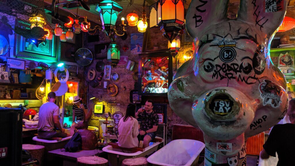 Funky Szimpla Ruins Pub - patrons drinking in bathtubs.  One of our favorite free things to see and do in Budapest.