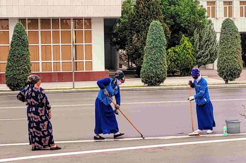 Bizarre Country Ladies cleaning the white lines
